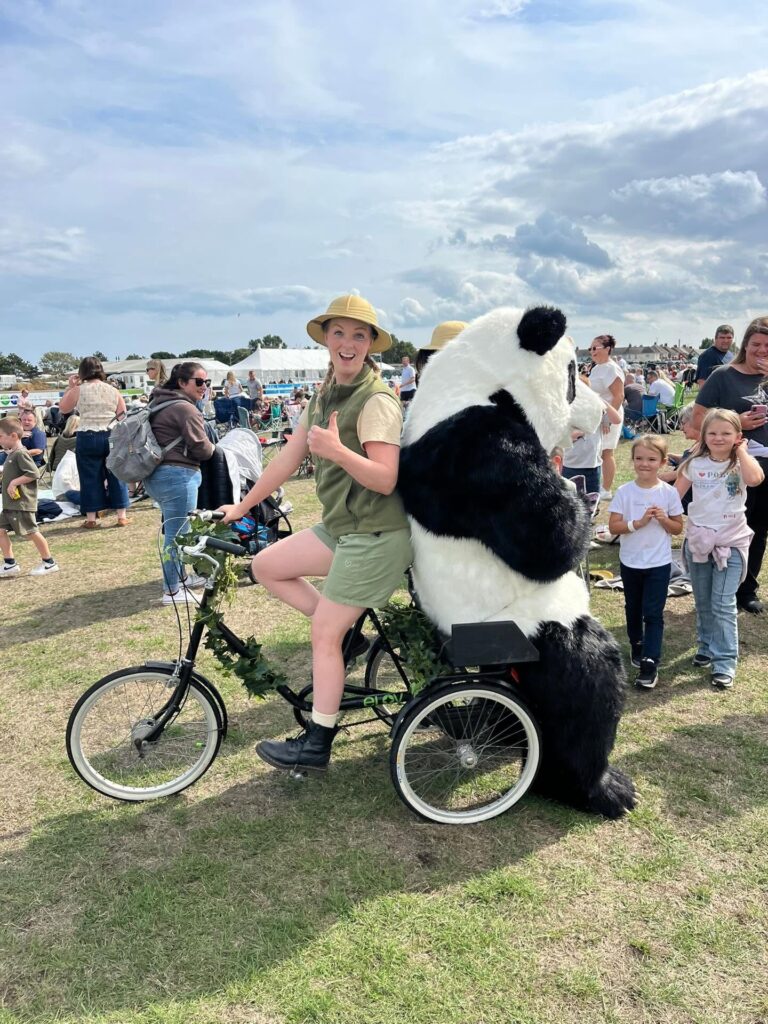 Giant Panda seated on tricycle at Great Yarmouth Racecourse August Bank Holiday 2026